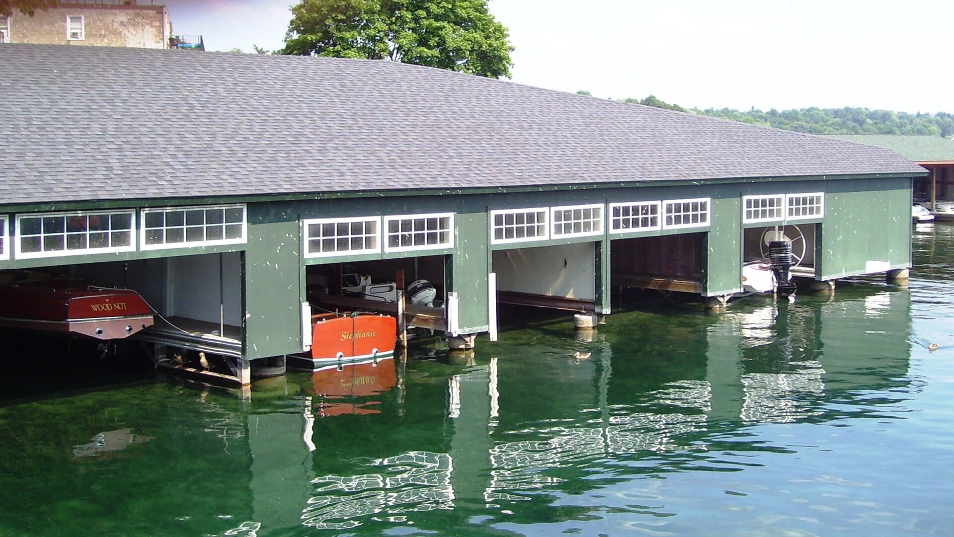 Historic boat garages on Skaneateles Lake seen from the village pier