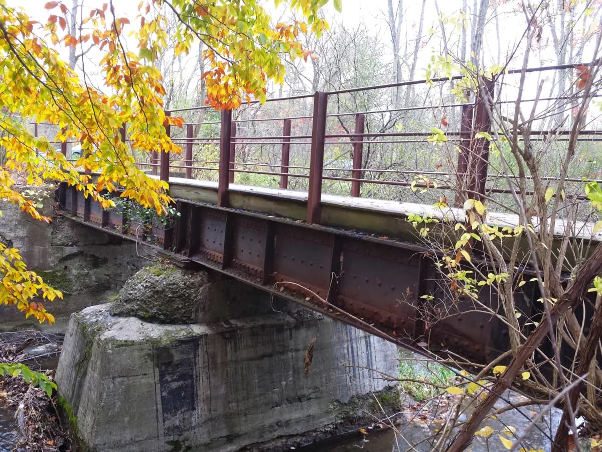 A former railroad bridge along the Charlie C. Major Nature Trail in autumn