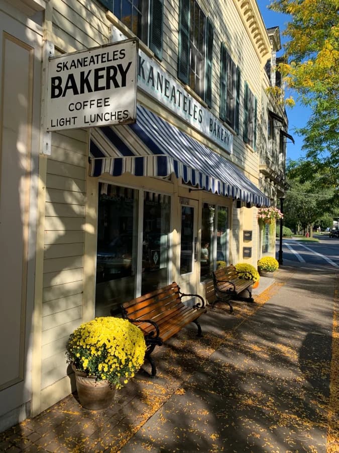 The striped awning and storefront of Skaneateles Bakery in the village
