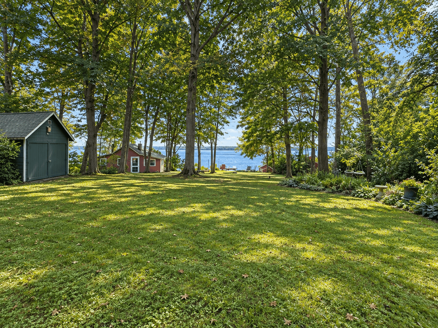 Wooded Skaneateles Landing grounds opening toward Skaneateles Lake