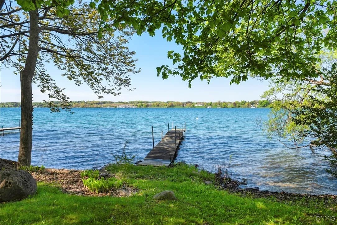 The wooded waterfront and dock at Skaneateles Landing
